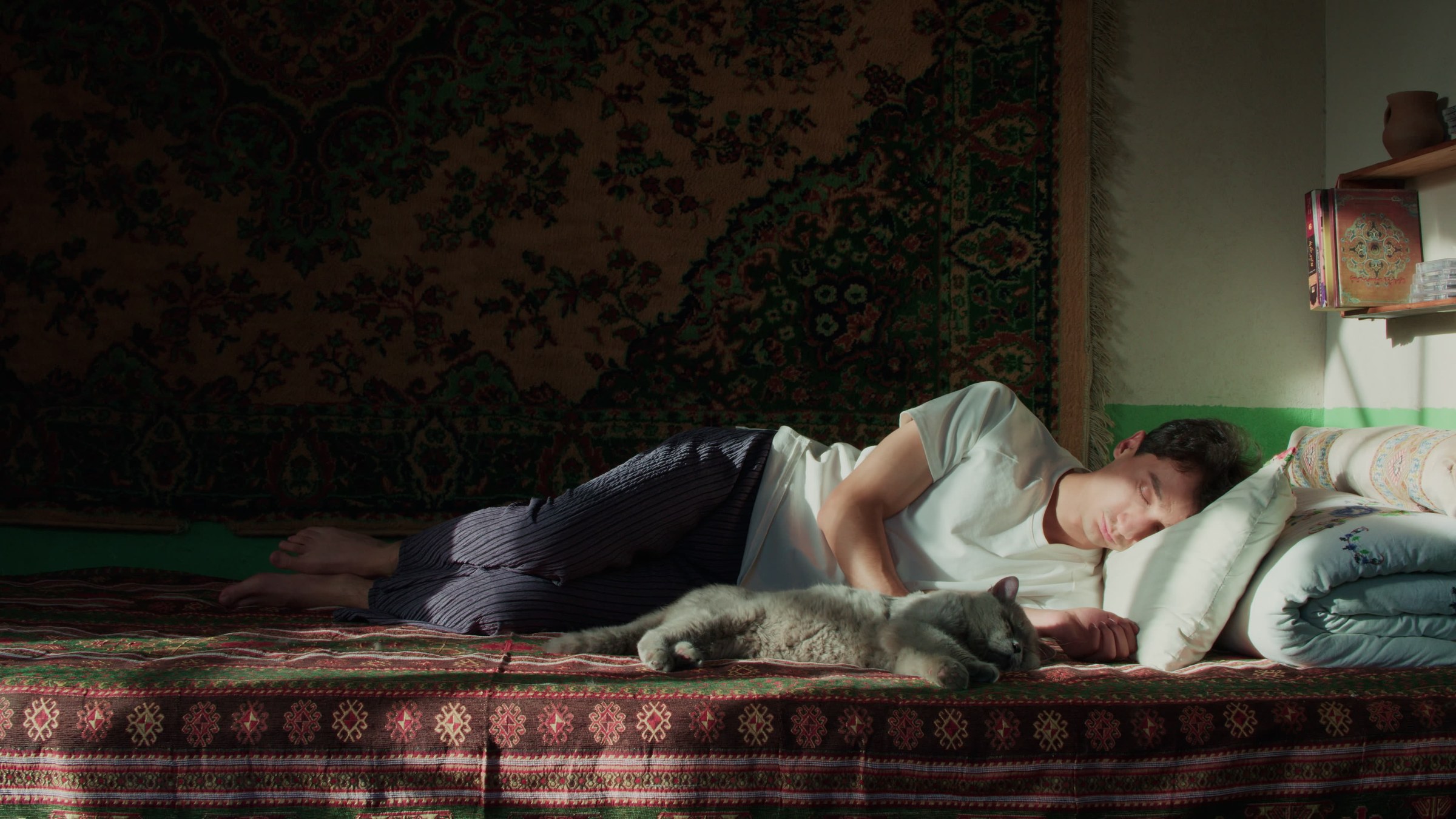 A person lying in a warm interior